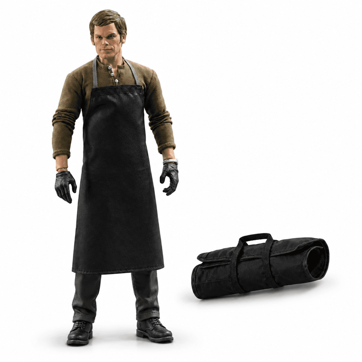 Dexter figure displayed beside a rolled tool bag